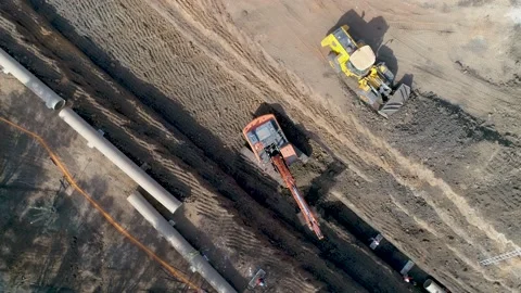 Loading dirt, debris and junk on truck container. Aerial shot above excavator Stock Footage 131016647