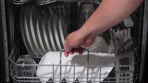 Loading dirty dishes into a dishwasher 스톡 동영상 313908039
