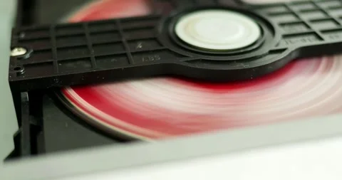 Loading a disc into a cd player home setting close-up shot technological Stock Footage 308232212