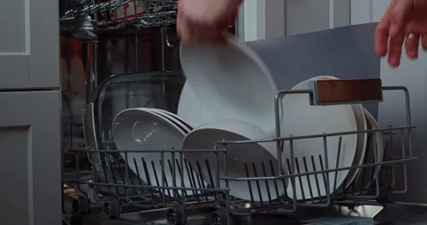 Loading dishes. Dishwashing capsules. Open dishwasher with clean dishes in the Stock Footage 264584918