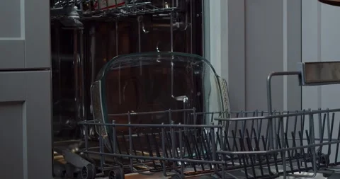 Loading dishes. Dishwashing capsules. Open dishwasher with clean dishes in the Stock Footage 264584925
