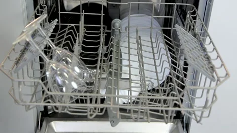 Loading dishes, glasses, wine glasses into the dishwasher Stock Footage 167797295