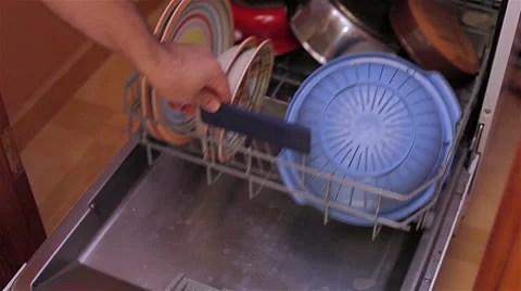Loading a dishwasher Video stock 50987629