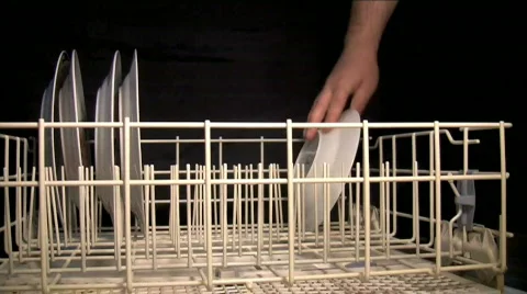 Loading dishwasher by hand Stock Footage 733258
