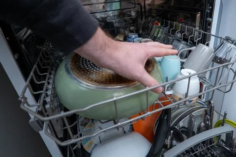 Loading the dishwasher Stock Photos