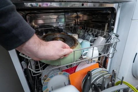 Loading the dishwasher Stock Photos