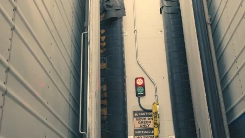 Loading dock traffic light signaling inside a semi-trailer Stock-Footage 346007685