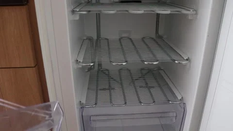 Loading drawers into a defrosted freezer Video stock 137955781