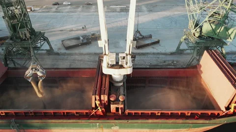 Loading of a dry cargo ship by wheat cranes in city port Varna on sunset Stock Footage 142524730