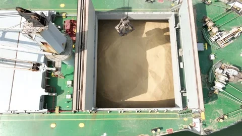 Loading dry cargo ship of wheat by cranes in port. Stock Footage 285379641