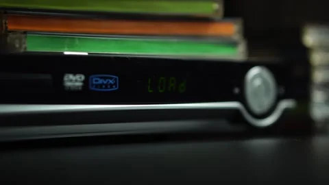 Loading DVD Disc into Player, Close Up Stock Footage 296787324
