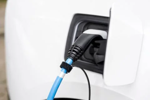 Loading an electric car Stock Photos