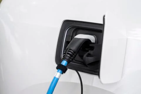 Loading an electric car Stock Photos