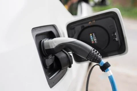 Loading an electric car Stock Photos