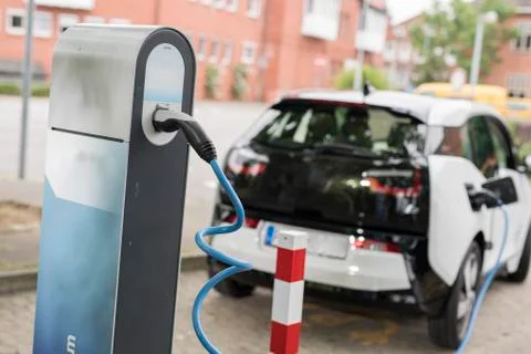 Loading an electric car Stock Photos