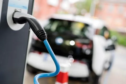 Loading an electric car Stock Photos