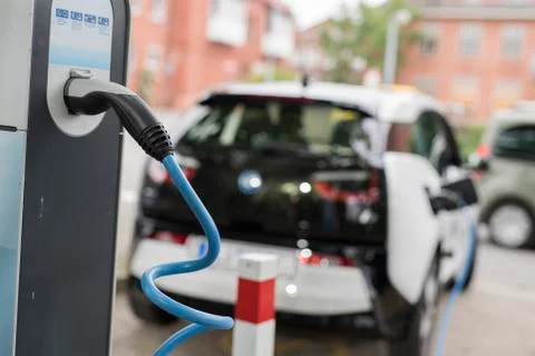 Loading an electric car Stock Photos