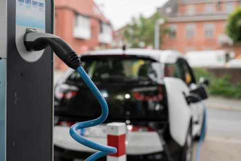 Loading an electric car 스톡 사진