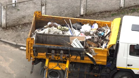 Loading garbage into the car Stock Footage 91950256