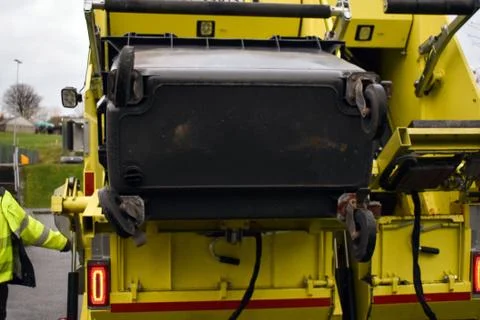 Loading garbage in the garbage truck. Garbage removal. Stock Photos