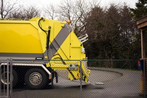 Loading garbage in the garbage truck. Garbage removal. Stock Photos