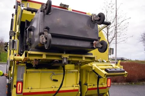 Loading garbage in the garbage truck. Garbage removal. Stock Photos
