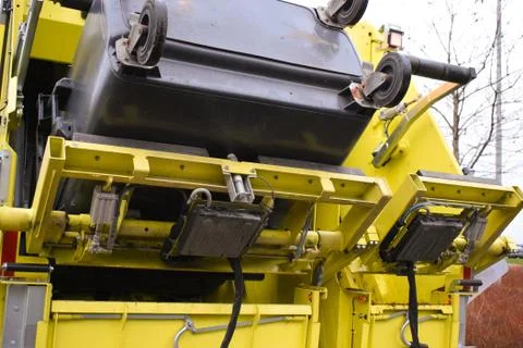 Loading garbage in the garbage truck. Garbage removal. Stock Photos