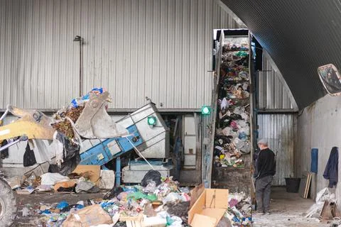 Loading garbage onto the tape Stock Photos