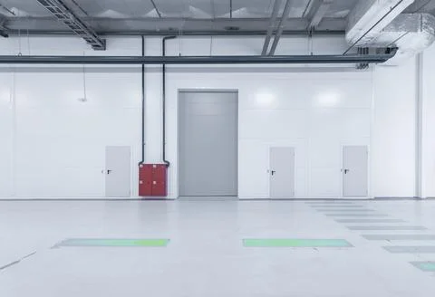 Loading gates of a large industrial warehouse. Stock Photos