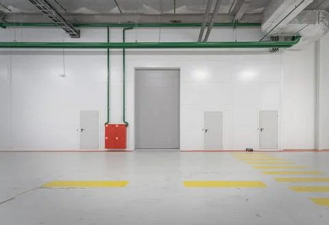 Loading gates of a large industrial warehouse. Stock Photos