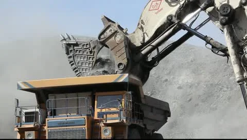 Loading the gold ore into heavy dump truck at the opencast mining Stock Footage 11055802