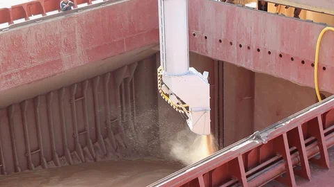 Loading grain onto a cargo ship for transportation by sea by a conveyor belt mac Stock Footage 120702586