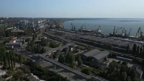 Loading grain onto a cargo ship for transportation by sea by a conveyor belt mac Stock Footage 158666105