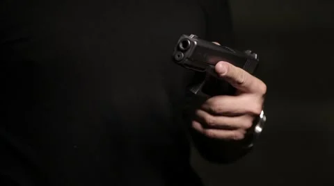 Loading a gun with bullets Stock Footage 61570807