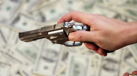 Loading Gun over Cash Background Stock Footage 22759967