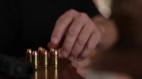 Loading a handgun magazine Video stock 52659378