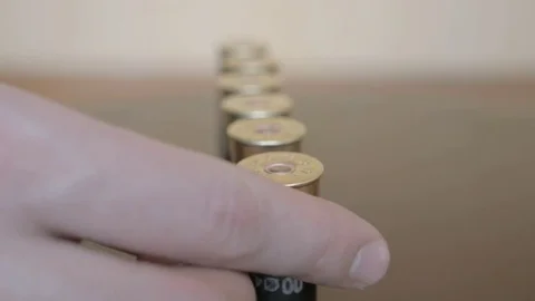 Loading a handgun magazine Stock Footage 73832930