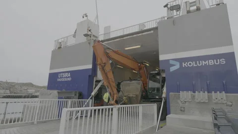 Loading heavy machinery onto island ferry boat 動画素材 130596120