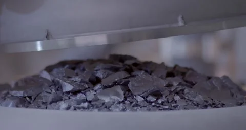 Loading High Purity Silicon Chunks into Quartz Crucible 4K 動画素材 344052469