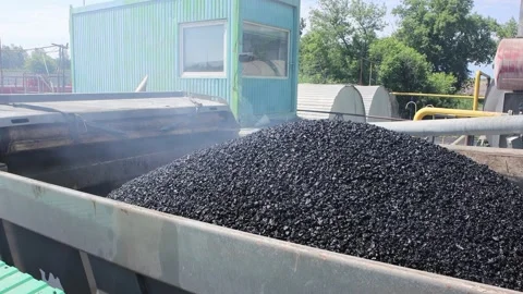 Loading hot asphalt into the dump truck body. Stock Footage 201507540