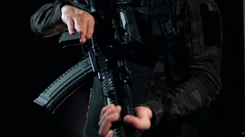 Loading a Kalashnikov assault rifle in a modern tactical body kit Stock Footage 144069827