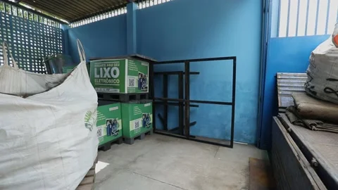 Loading a large bag of computer components and circuit boards on a truck Stock Footage 149793021