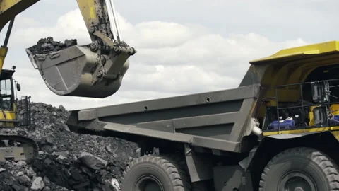 Loading a large mining truck with coal at a coal mine. Stock Footage 219857072