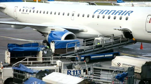 Loading luggage on to aircraft Stock Footage 878965