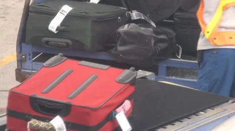 Loading luggage onto plane Stock Footage 1240060