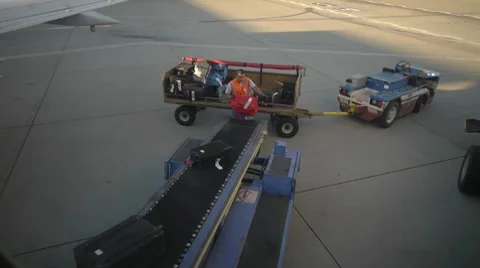 Loading Luggage Onto Plane Stock Footage 8684543
