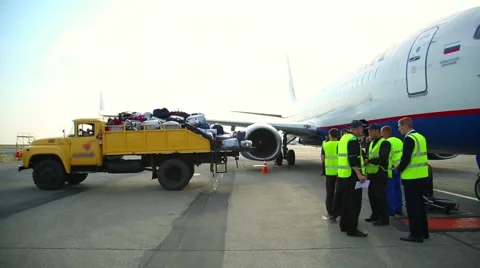 Loading luggage in a plane Stock Footage 53867091