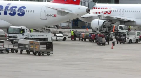 Loading luggage in a plane before take-off Stock Footage 41373493