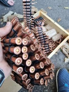 Loading machine gun belt Stock Photos