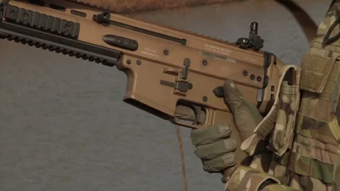 Loading magazine in to gun 2 Video stock 76940313